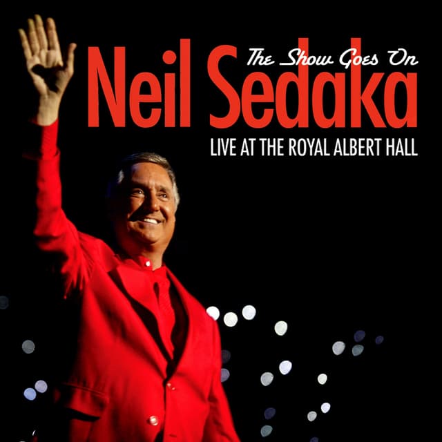 Album cover art for The Show Goes On - Live at the Royal Albert Hall
