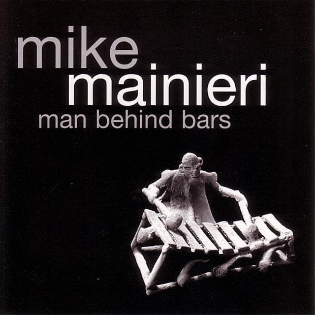 Album cover art for Man Behind Bars