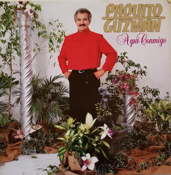 Album cover art for Aqui Conmigo